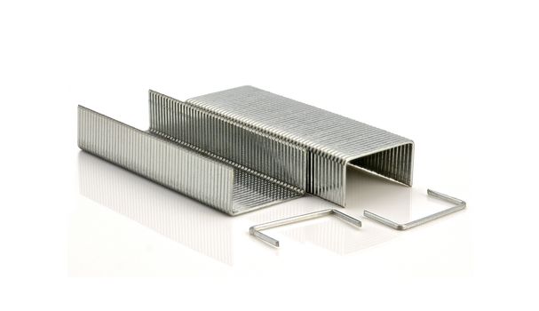 Stack of metal staples on a white background