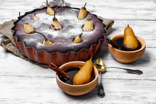 Pie with pears and coffee drink with cinnamon