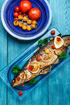 Baked in tomatoes and spices whole fish