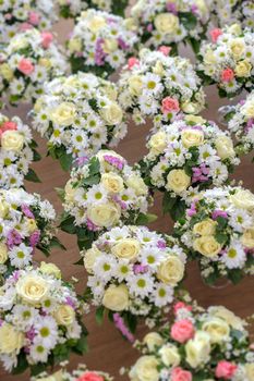 Several bouquets in several glasses of champagne