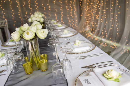 Elegance table set up with lotus flowers, selective focus.