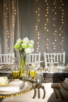 Elegance table set up with lotus flowers, selective focus.