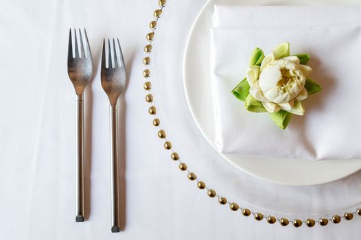 Elegance table set up with lotus, selective focus.