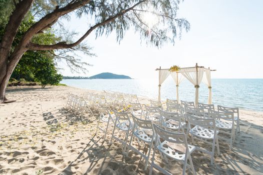 simple style wedding arch and decoration, venue, setup on tropical beach, outdoor beach wedding.