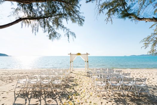 simple style wedding arch and decoration, venue, setup on tropical beach, outdoor beach wedding.