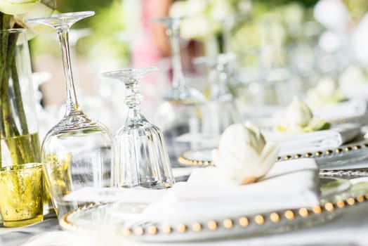 Elegance table set up with lotus flowers, selective focus.