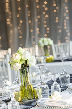 Elegance table set up with lotus flowers, selective focus.