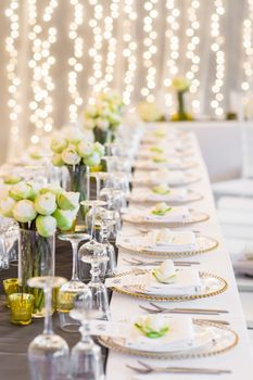 Elegance table set up with lotus flowers, selective focus.