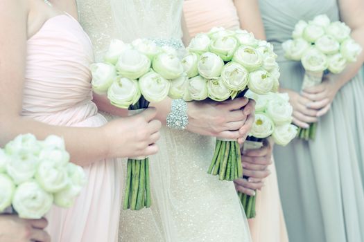 bouquets in females hand, selective focus.