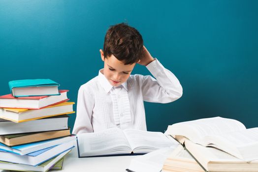 Student at elementary school thinking about problem solving, blue background