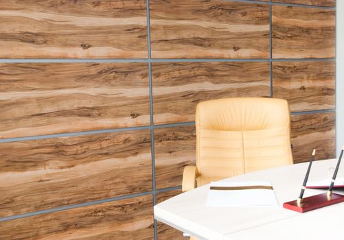 Modern office interior design with wall of synthetic wood panels