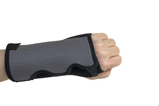 Woman pain hand in black wrist bandage with isolated.