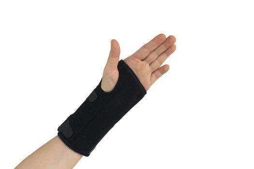 Woman pain hand in black wrist bandage with isolated.