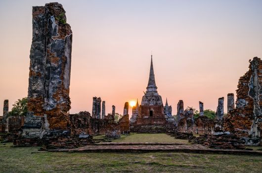 Ruins and pagoda ancient architecture of Wat Phra Si Sanphet old temple famous attractions during sunset at Phra Nakhon Si Ayutthaya Historical Park in Ayutthaya Province, Thailand