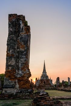 Ruins and pagoda ancient architecture of Wat Phra Si Sanphet old temple famous attractions during sunset at Phra Nakhon Si Ayutthaya Historical Park in Ayutthaya Province, Thailand