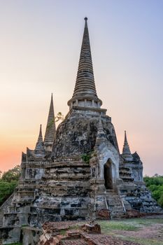 Ruins and pagoda ancient architecture of Wat Phra Si Sanphet old temple famous attractions during sunset at Phra Nakhon Si Ayutthaya Historical Park in Ayutthaya Province, Thailand