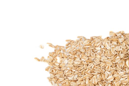 Oats flakes pile on white background
