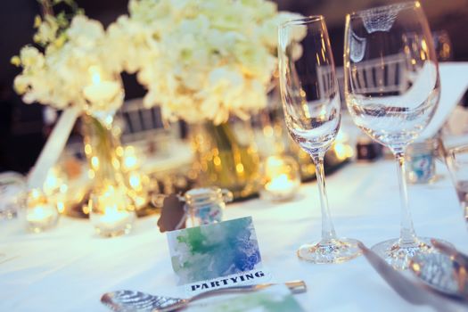 Romantic dinner setup, decoration with candle light. Selective focus.