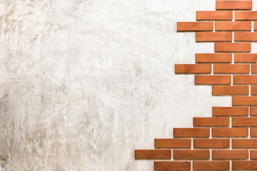 Red bricks pattern on polished cement wall.