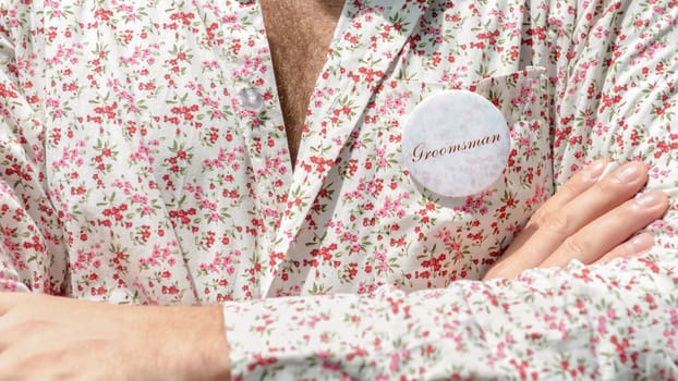 Closeup man in floral shirt.