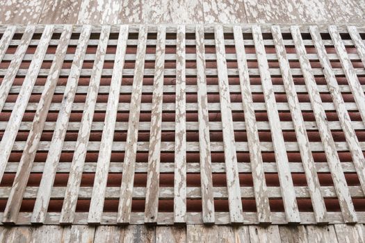 Wooden grate window of old style thai house.