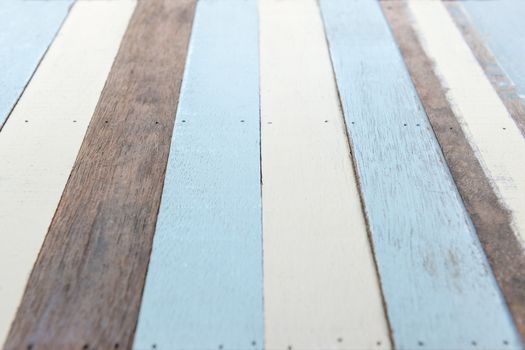 Perspective wooden plank on natural, white and blue color, selective focus.