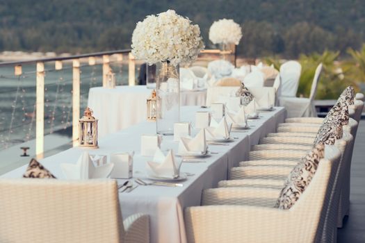 Romantic dinner setup, decoration with candle light. Selective focus.