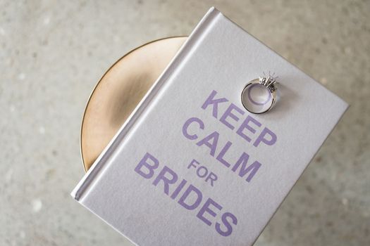 Bridal ring on book.