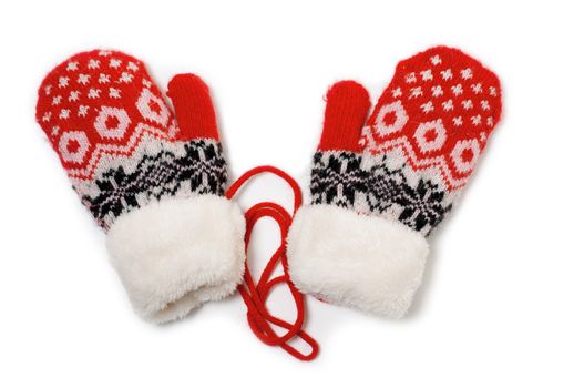 a pair of red baby mittens with pattern on white background