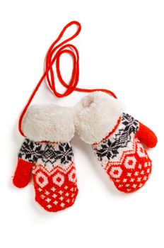 a pair of red baby mittens with pattern on white background
