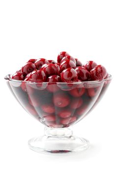 cherry compote in a glass vase on white background
