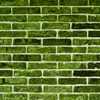 Background of Green and Black Bricks with Cracked Surface and Concrete closeup Outdoors