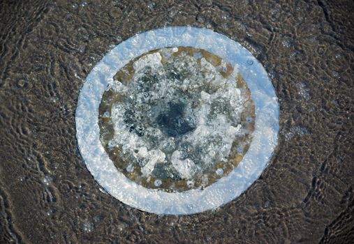 water overflow fountain on concrete floor sewage cap flood