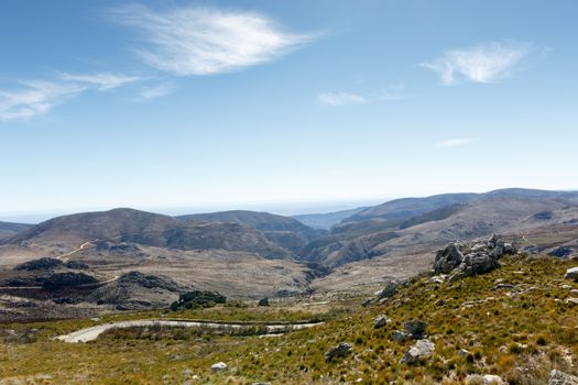 Down we go - The Swartberg mountains are a mountain range in the Western Cape province of South Africa. It is composed of two main mountain chains running roughly east-west along the northern edge of the semi-arid Little Karoo.