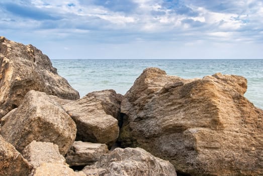 Stones at the seashore in cloudy weather