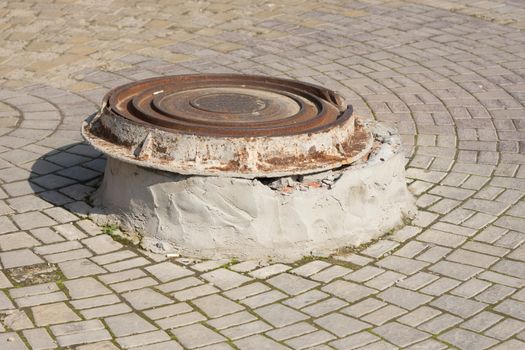 MOVE well cover on a concrete pedestal