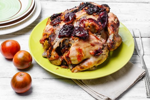 Lunch dish with roasted carcass of chicken in plum sauce