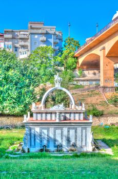 Ancient fountain in the middle of italian city