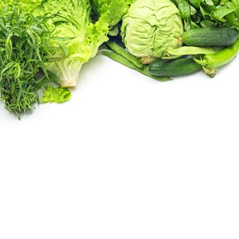 Pile of green vegetables isolated on white background with copy space