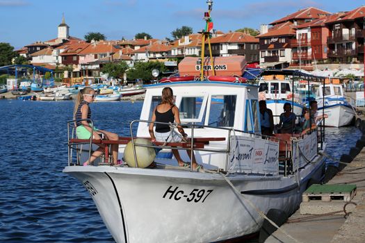 Nessebar, Bulgaria - July 16, 2016:  Two Young Girls Sitting in a Boat, Sailing Between Nessebar and Sunny Beach on the Coast of the Black Sea in Bulgaria