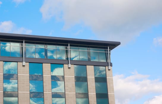 building architecture windows on blue cloudy sky