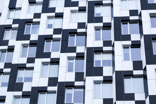 Black and white minimalistic bauhaus office building of business center - chequered background
