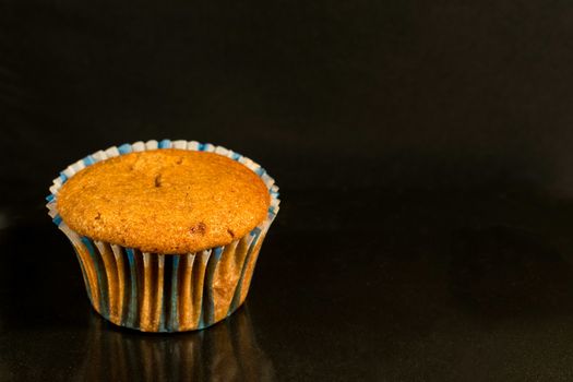 Homemade muffin in a darken background