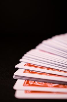 Playing cards in a black background