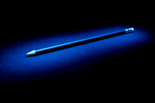 Lightpainting of a black pencil with black background