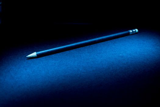 Lightpainting of a black pencil with black background