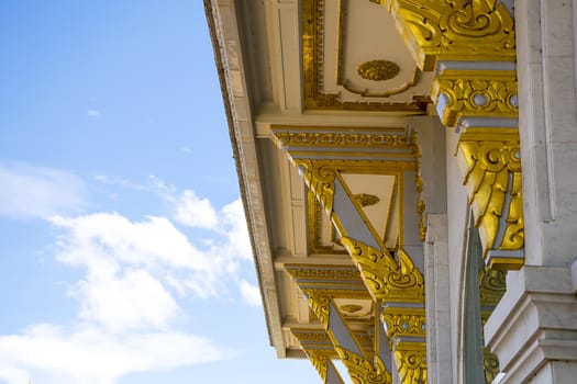 Detail of roof temple' construction with clear sky background at Wat Sothorn, Chachoengsao Thailand