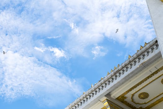 Detail of roof temple' construction with clear sky background at Wat Sothorn, Chachoengsao Thailand