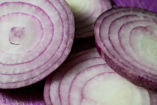 Cutten Tropea onions in a purple background