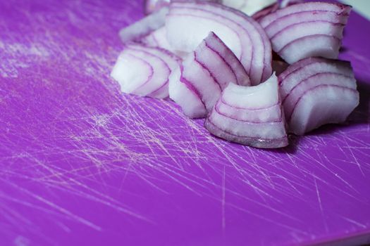 Cutten Tropea onions in a purple background